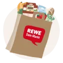 Eine REWE Papiertüte voll unterschiedlicher Produkte.