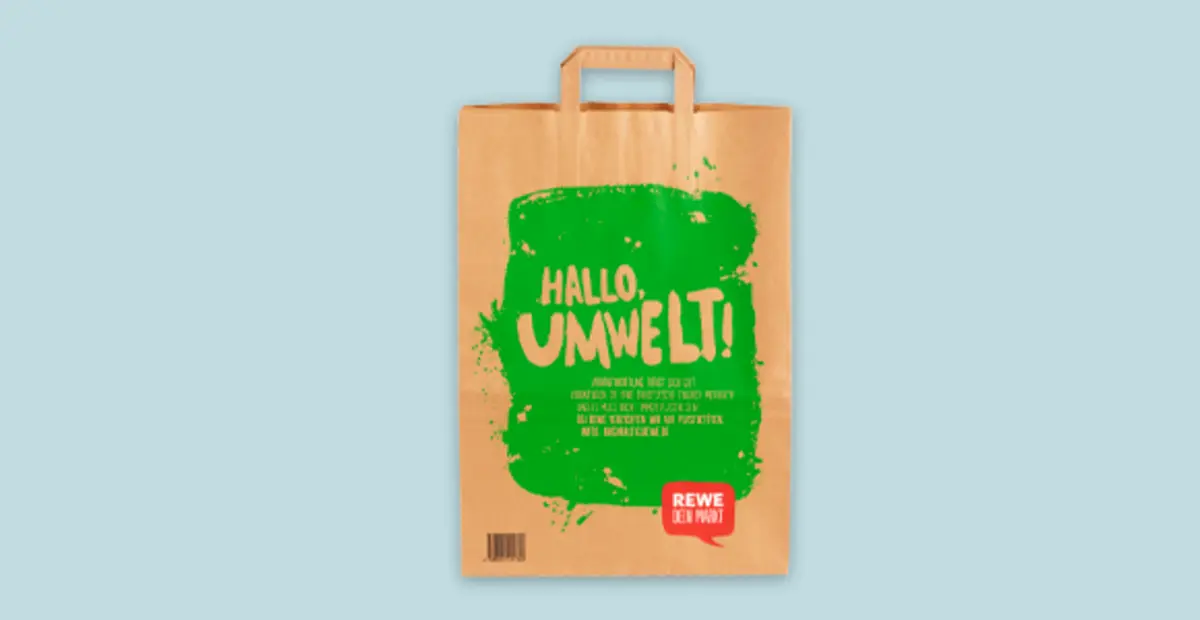 Eine REWE Papiertüte.