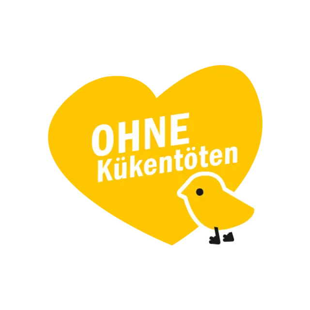 Ein gelbes Herz mit einem kleinen, illustrierten Küken. Auf dem Herz steht „Ohne Kükentöten“.